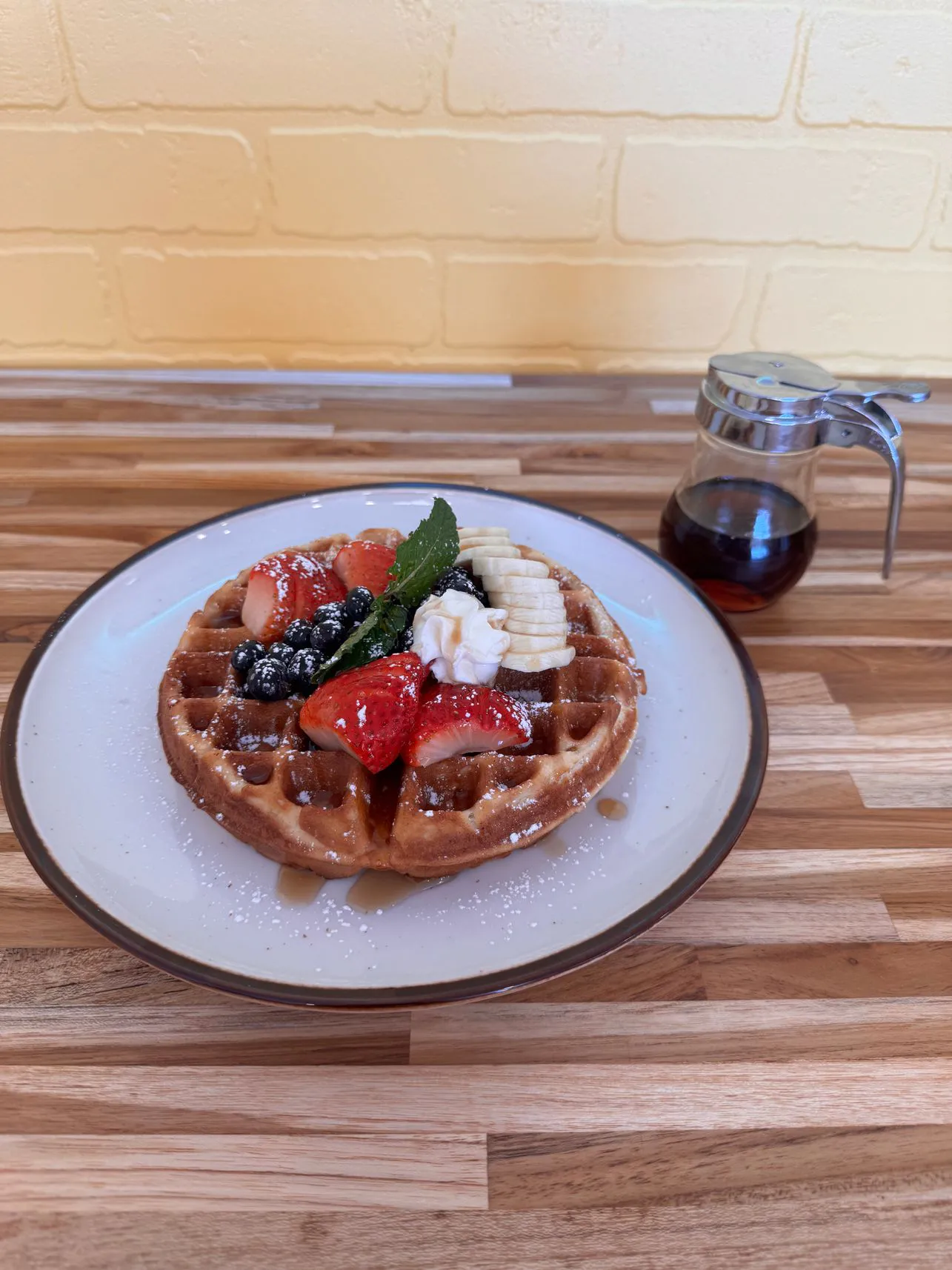 Berry waffle with banana and syrup at Simply Sabroso by Taqueria Rendon, a Café & Dessert Shop in Northfield