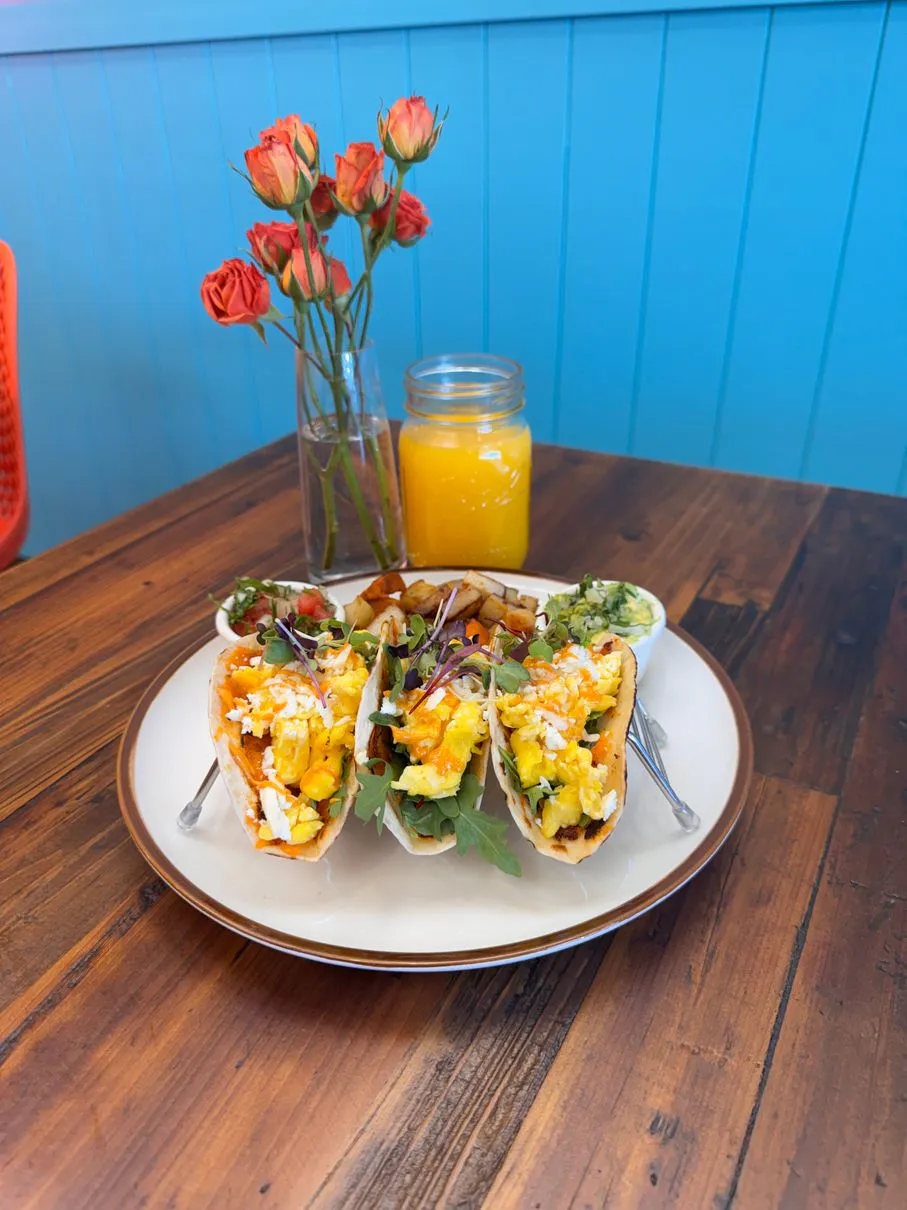 Breakfast tacos with orange juice at Simply Sabroso by Taqueria Rendon, a Café & Dessert Shop in Northfield