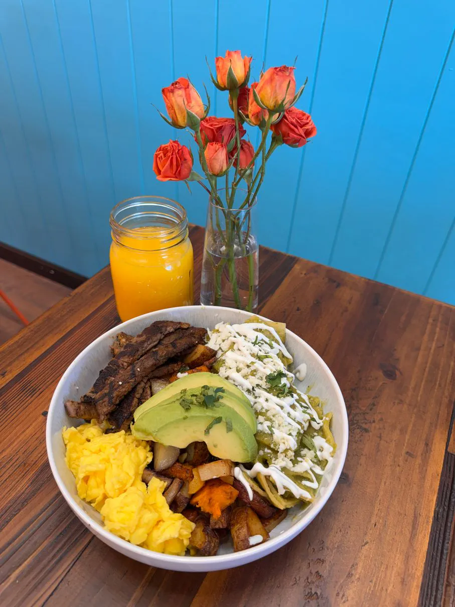 Steak breakfast bowl with orange juice at Simply Sabroso by Taqueria Rendon, a Café & Dessert Shop in Northfield